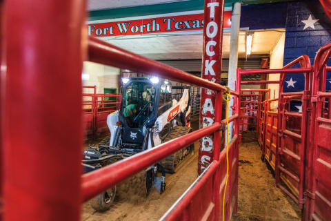 Farmer Using Compact Track Loader With Soil Conditioner