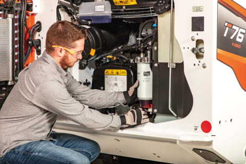 Customer Replacing Fuel Filter Inside Bobcat Compact Loader