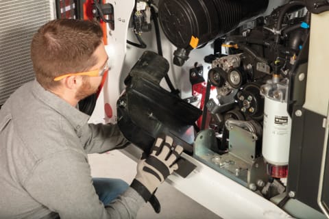 Owner Servicing Belts On Bobcat Compact Loader