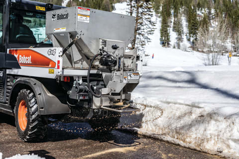 Bobcat UW56 Toolcat Utility Work Machine With Spreader Attachment On Jobsite