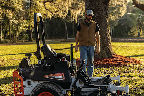 An Operator Approaches a Parked Bobcat ZT6000 Zero-Turn Mower