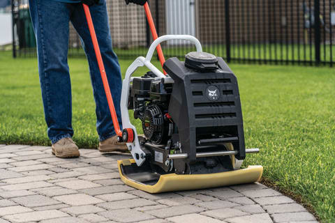 Operator using the Bobcat Forward plate compactor highlighting the rubber mat.