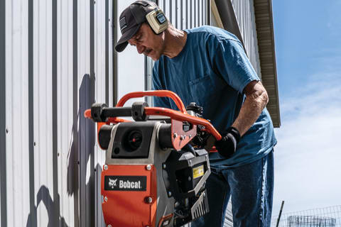 Operator using the Bobcat Rammer in a tight space displaying optimal control.