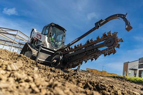 Bobcat compact track loader with trencher attachment