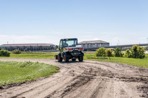 Utility Work Machine on a Dirt Road