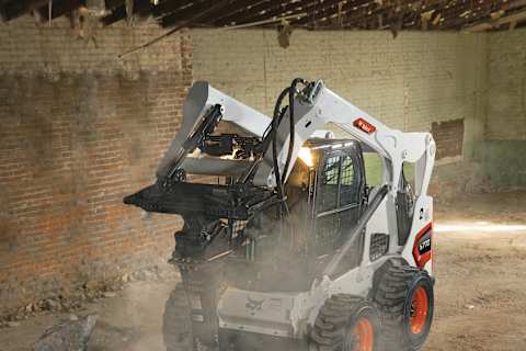Bobcat s770 Skid-Steer Loader Carrying Load of Debris From Interior Demolition