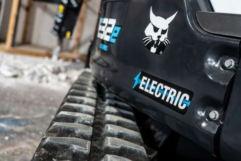 Close-up of All-Electric Compact Excavator Tracks