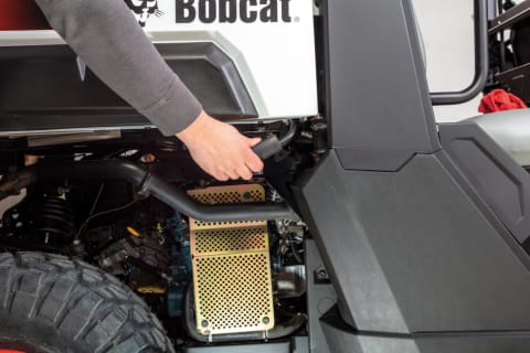 Bobcat Utility Vehicle (UTV) owner maintaining vehicle.
