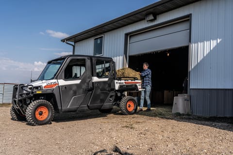 Bobcat Customer Loads Haybales In UTV Cargo Box