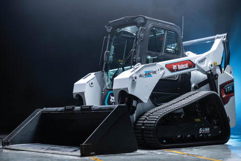 T7X All Electric Compact Track Loaders in Studio with Blue Lighting