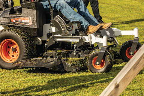 Closeup mowing action shot of durable Bobcat ZT7000 zero-turn riding mower