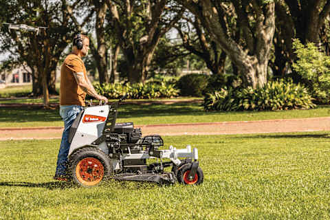 Durable, commercial-grade Bobcat ZS4000 zero-turn stand-on mower delivering a pristine cut on large, residential property
