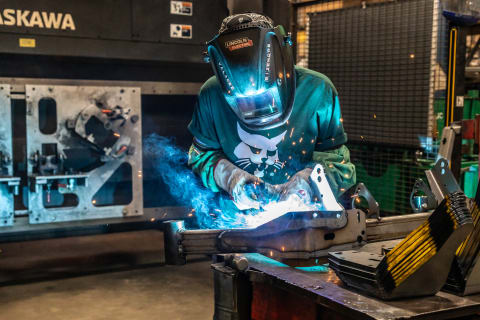 A Bobcat Employee Welds Metal