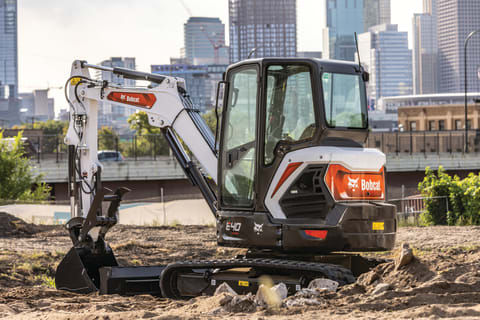 The Bobcat E40 compact excavator sits on the jobsite in front of the Minneapolis skyline.