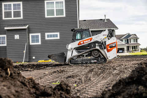 A Bobcat T86 Compact Track Loader Traveling on a Jobsite