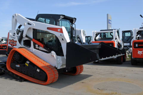 Bobcat Compact Track Loader being transferred off trailer