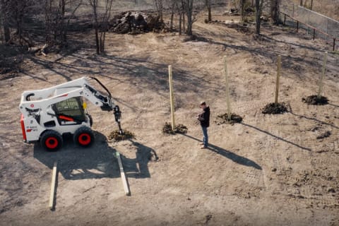 Operator using Bobcat MaxControl on Loader