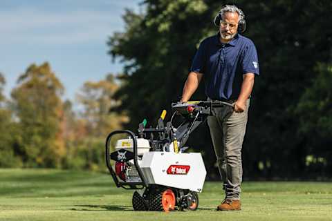 An Operator Uses a Bobcat SC12 Sod Cutter