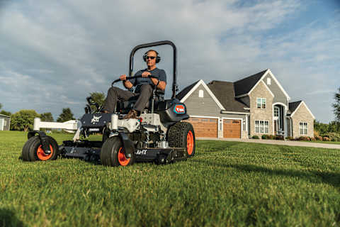Homeowner giving lawn a pristine cut with the Bobcat ZT6000e electric zero-turn riding mower