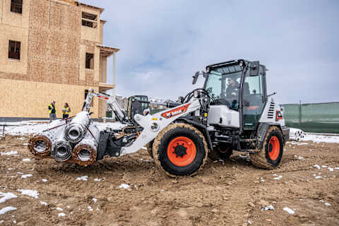 Bobcat L95 Compact Wheel Loader With Pallet Fork Attachment in Construction Environment