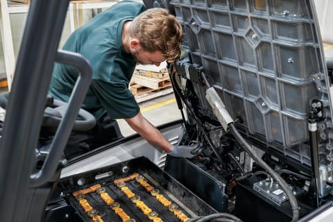 A Man Performing Routine Service on the B20T-7 Plus Forklift