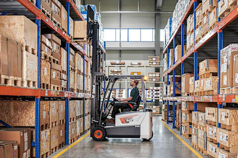Operator Grabs a Pallet From a High Shelf Using a Bobcat B20T-7 Plus Forklift