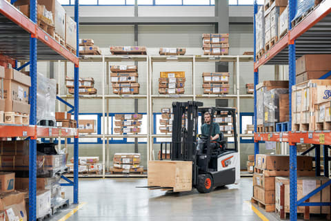 Bobcat B20T Plus Forklift Carries a Pallet in a Warehouse