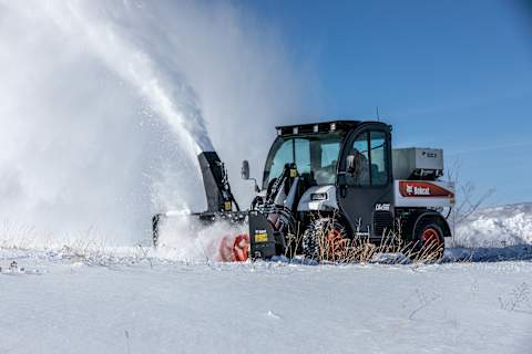 Bobcat Toolcat UW56 Throwing Snow With Snowblower Attachment
