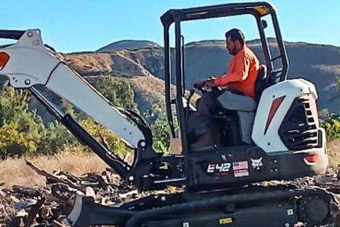 Mario Coss Operates a Bobcat E42 Compact Excavator on a Jobsite