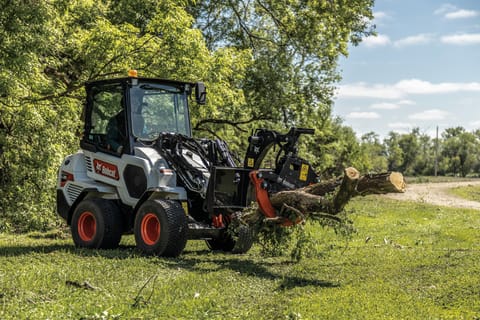 Bobcat L28 Loader Swiftly Moving Logs With Log Grapple Attachment 