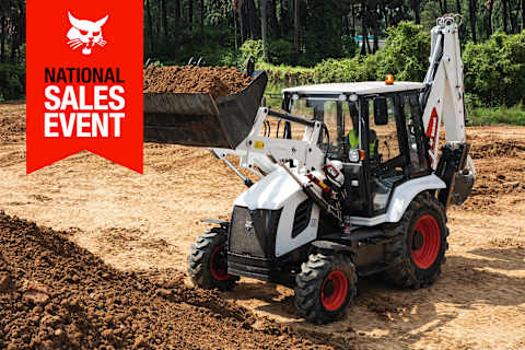 A Bobcat B760 Backhoe Loader Moves Dirt; the National Sales Event Banner Is on the Top-Left Corner