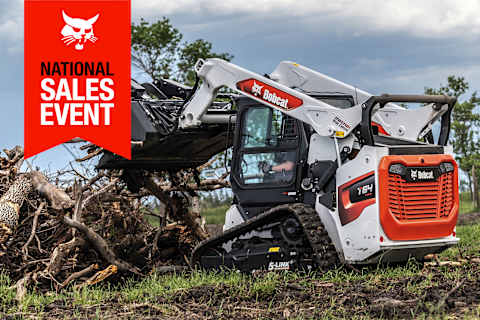 A Bobcat T64 Compact Track Loader With an Industrial Grapple Clears Tree Branch Debris; the National Sales Event Banner Is on the Top-Left Corner