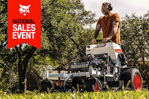 A Man Mows a Grassy Area Using the Bobcat ZS4000 Stand-On Mower