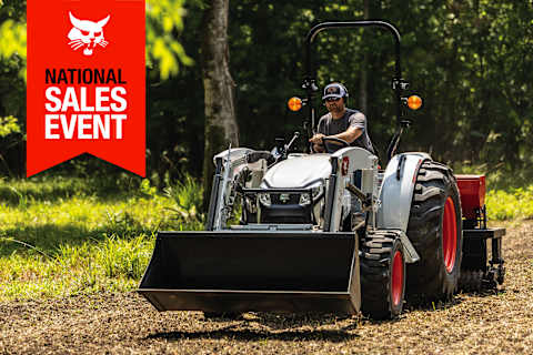 An Operator Plants Seed Using a Bobcat CT4045 Compact Tractor and a 3-Point Seeder Implement