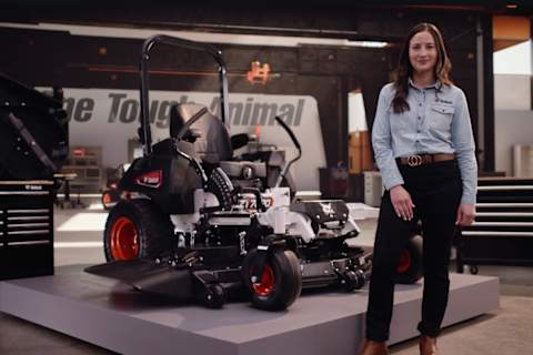 The Bobcat Advantage zero-turn mowers featuring Angie standing next to the ZT7000, displaying the maintenance access points.
