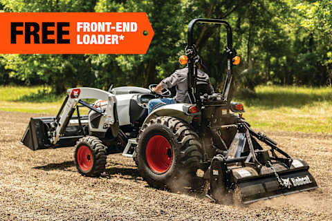 A Bobcat Compact Tractor Smooths a Plot of Soil; A Free Front-End Loader Banner Is in the Top-Left Corner