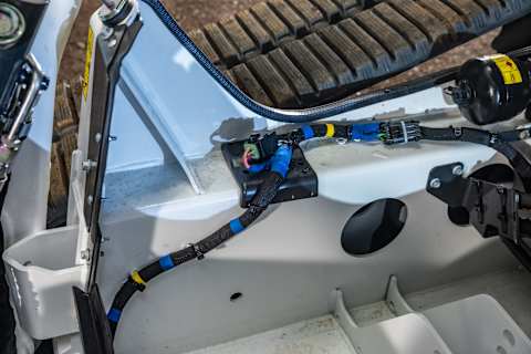 Close-Up View of Internal Wiring and Components Inside a Bobcat Pro T86 Compact Track Loader