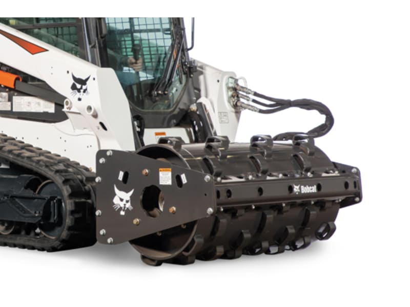 Vibratory packer outlet