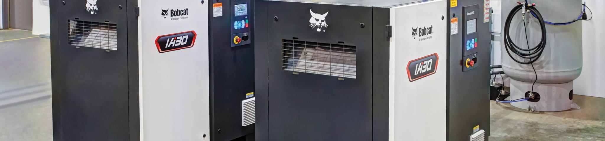 Two IA30 Air Compressors Side by Side in a Warehouse