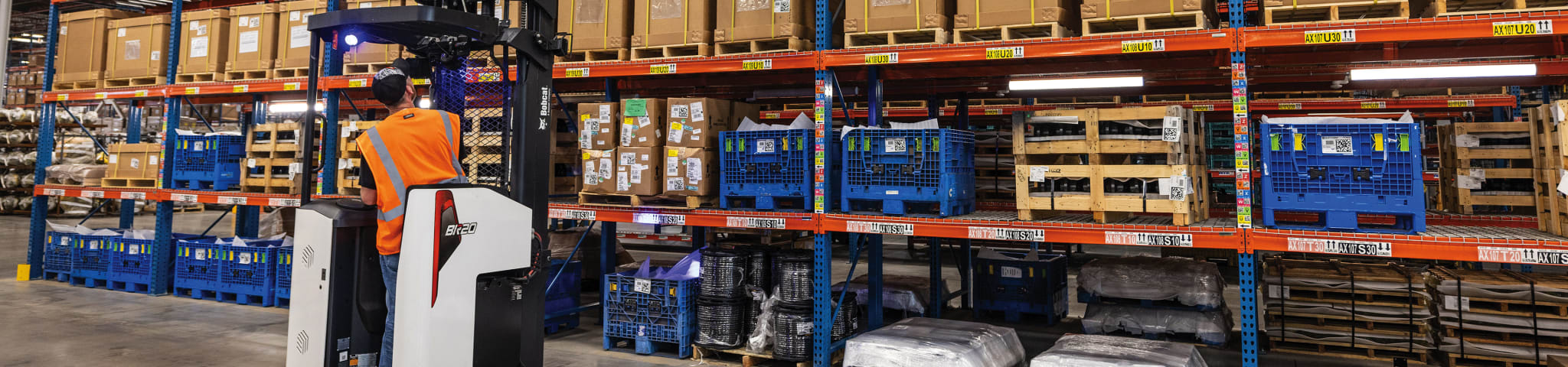 An Operator Uses a Bobcat BR20SP-7 Forklift to Reach Items in a Warehouse