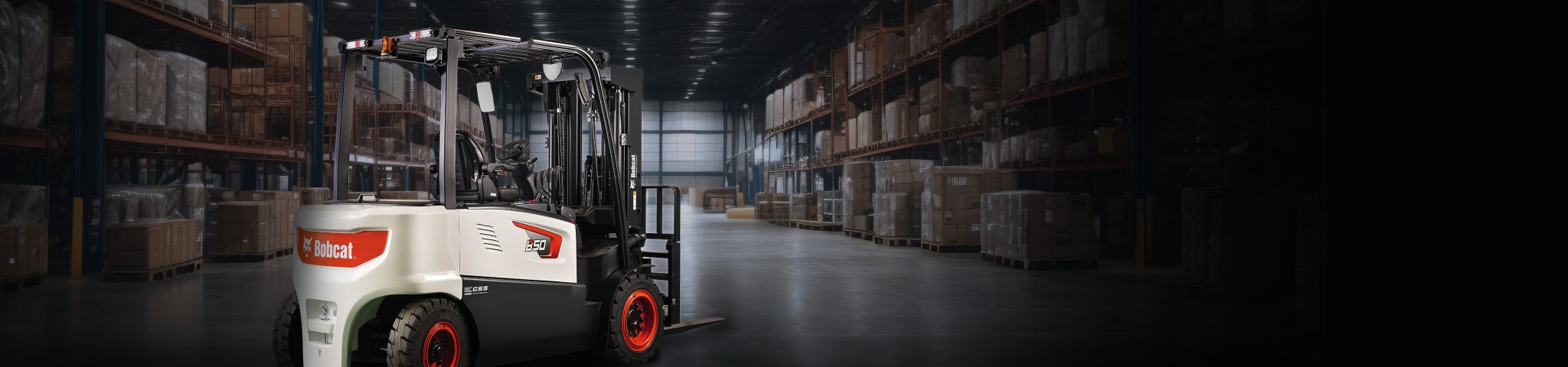 A Bobcat B50X-7 Forklift Parked in a Dimly Lit Warehouse