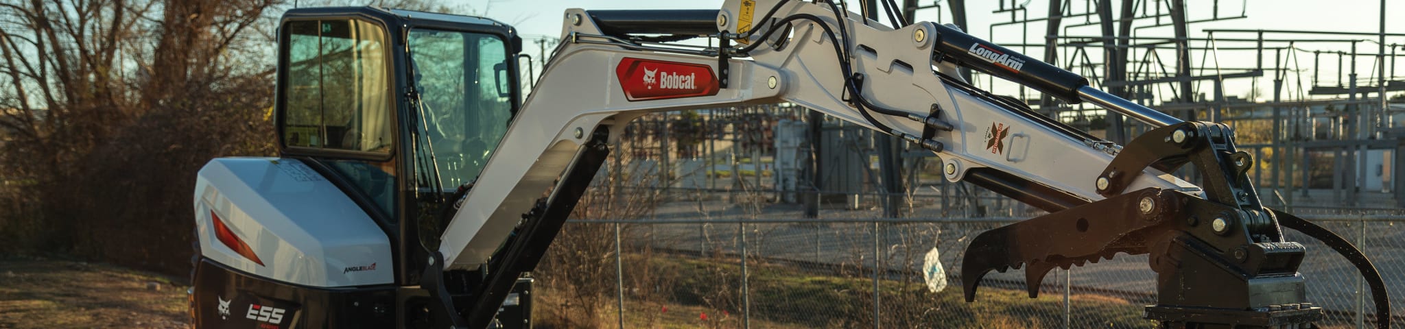 Operator Uses a Bobcat E55 Compact Excavator Equipped with a Nitrogen Breaker Attachment to Bust up Concrete