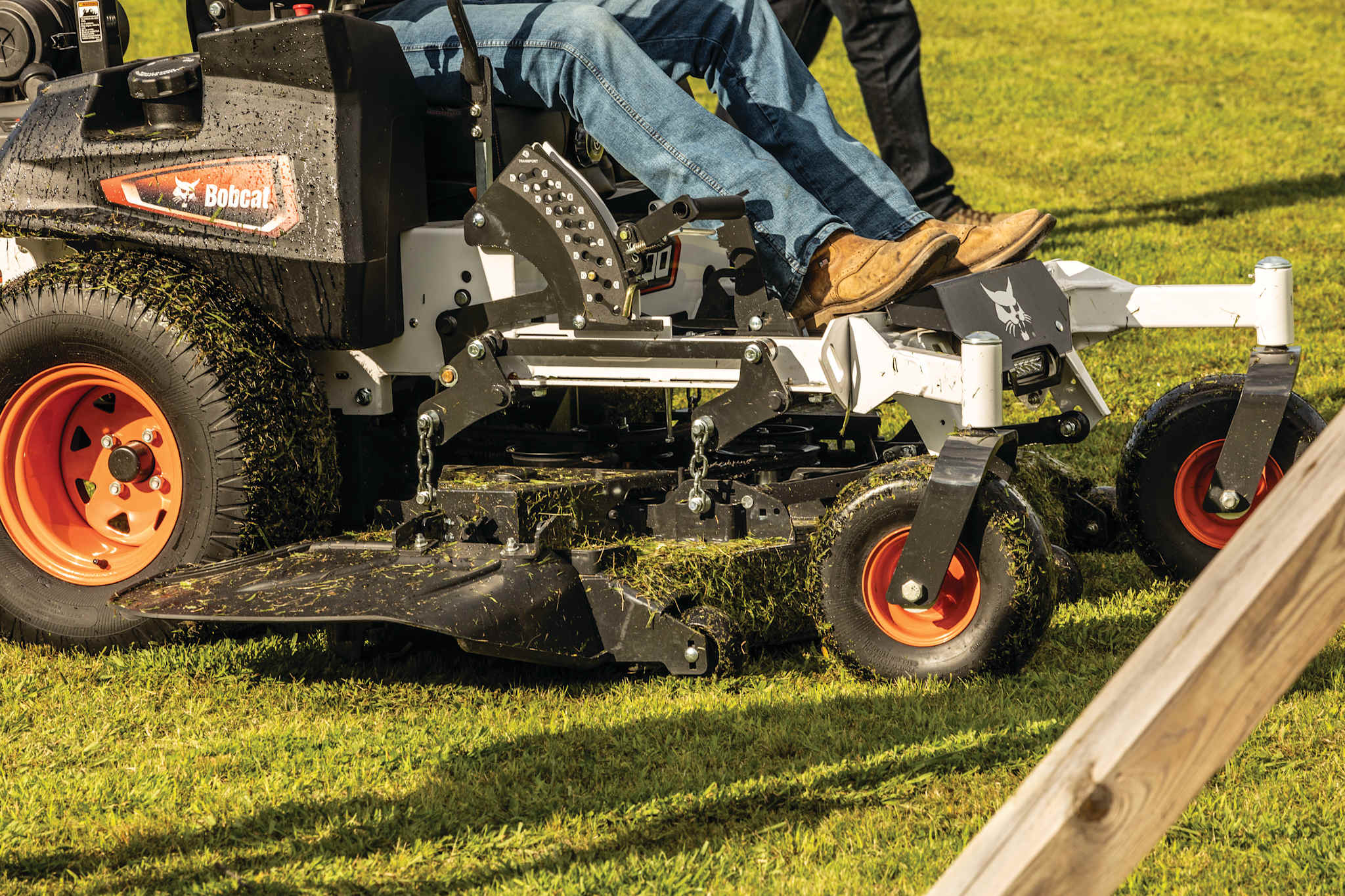 Closeup mowing action shot of durable Bobcat ZT7000 zero-turn riding mower