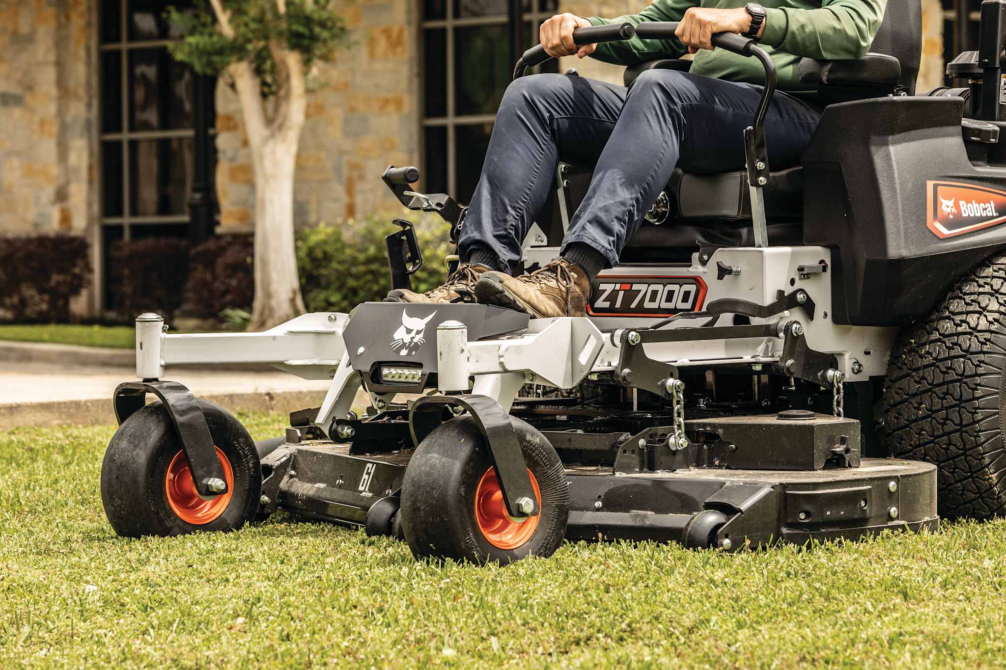 Closeup of durable frame, front wheels and AirFX mower deck on Bobcat ZT7000 zero-turn riding mower
