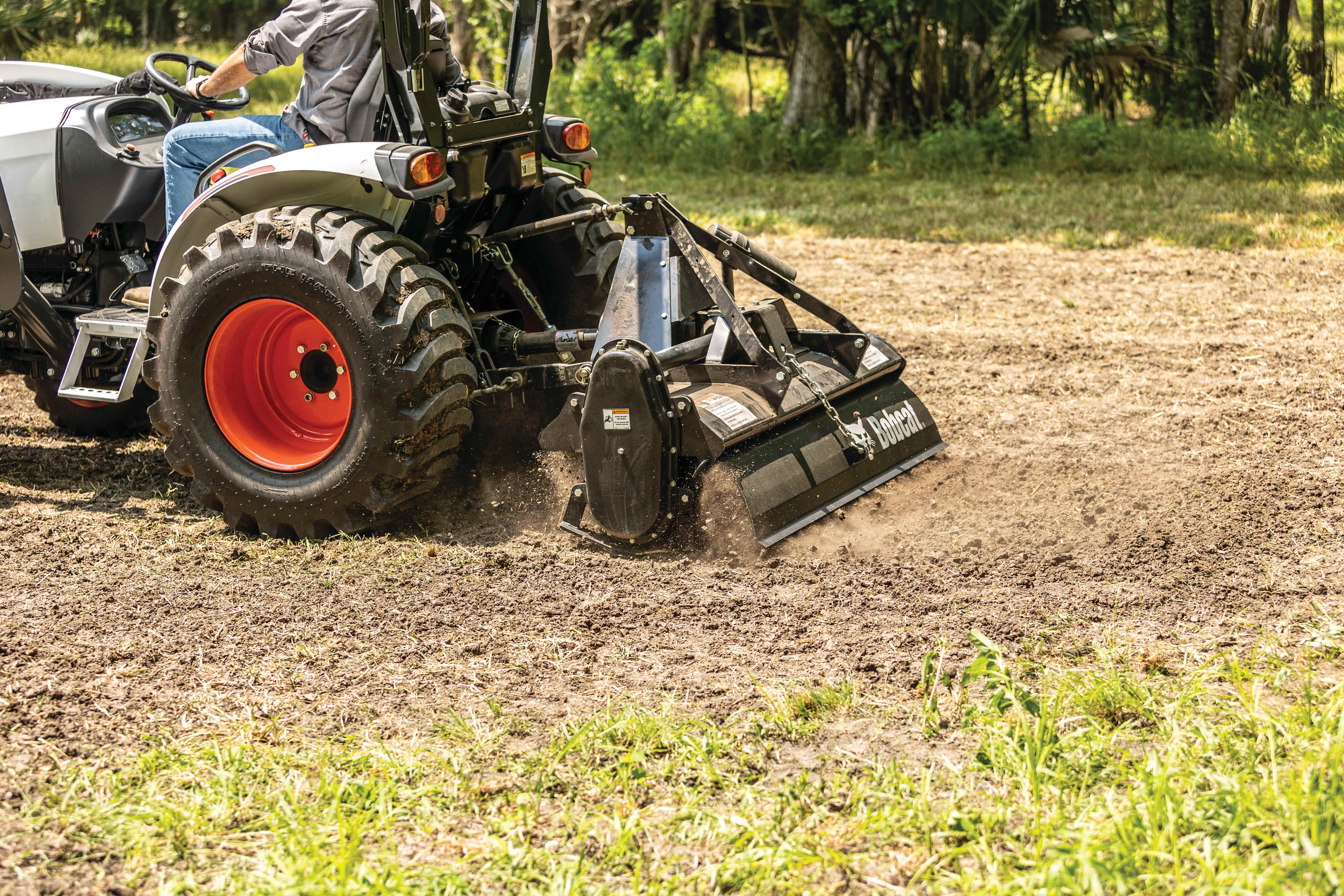An Operator Uses a Bobcat Compact Tractor and a Tiller Attachment to Break Up the Ground for a Food Plot  
