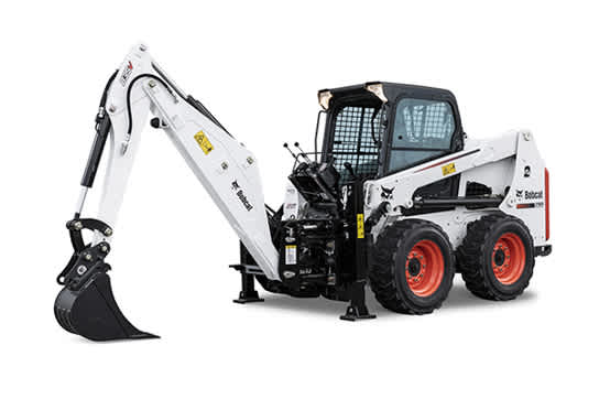 Bobcat backhoe attachment on skid-steer loader. 