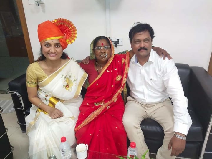 Dr. Manisha seated with two guests at a celebration