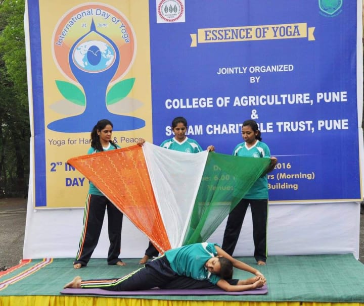 A yoga posture demonstration at a community event