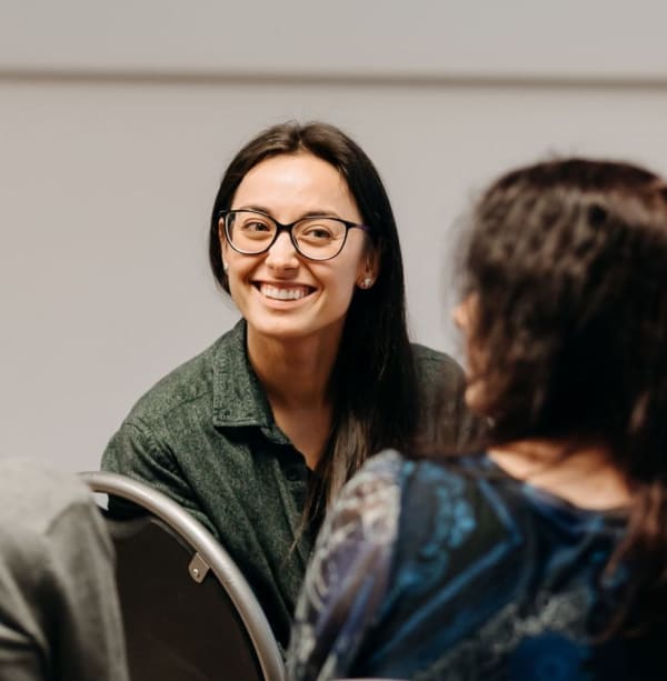 a girl programmer lecturer smiling