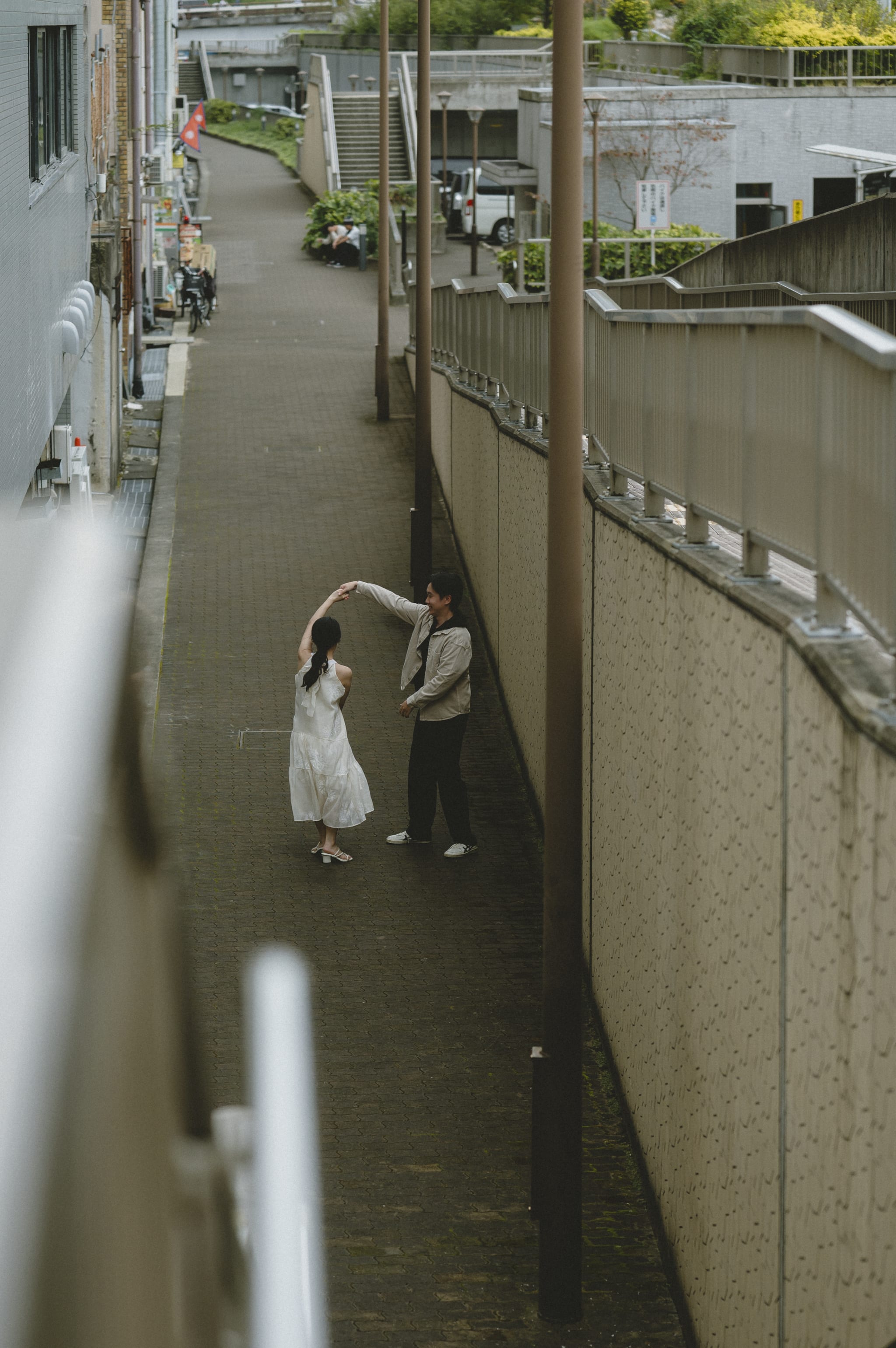 Holding hands in white dress